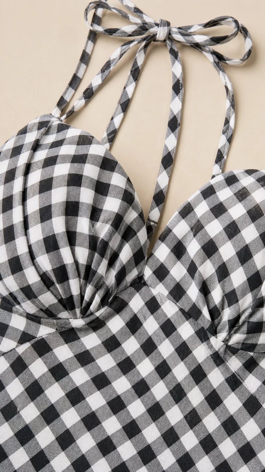 Close-up detail of sweetheart neckline and tie straps on gingham dress