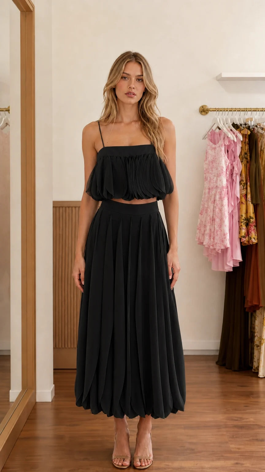 Front view of black two-piece set on model