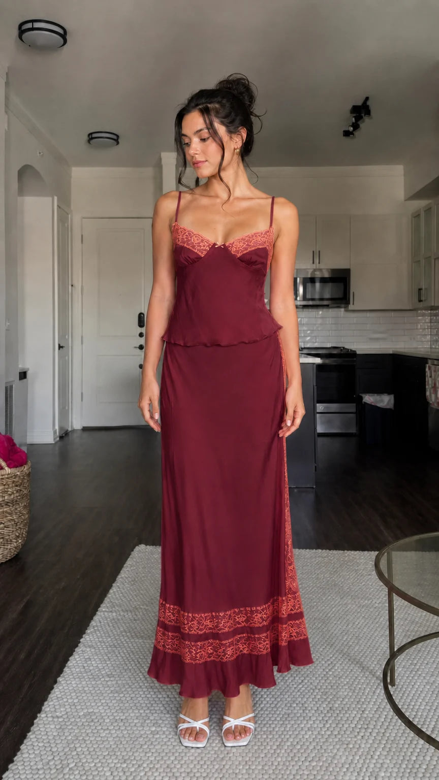 Model wearing burgundy two-piece satin set